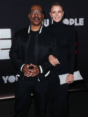 Eddie Murphy and girlfriend Paige Butcher arrive at the Los Angeles Premiere Of Netflix's 'You People' held at the Regency Village Theatre on January 17, 2023 in Westwood, Los Angeles, California, United States. 