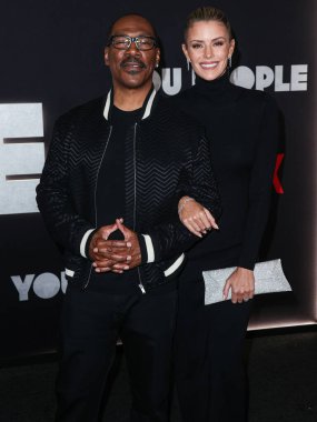Eddie Murphy and girlfriend Paige Butcher arrive at the Los Angeles Premiere Of Netflix's 'You People' held at the Regency Village Theatre on January 17, 2023 in Westwood, Los Angeles, California, United States. 