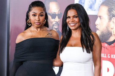 Yung Miami (Caresha Romeka Brownlee) and Nia Long arrive at the Los Angeles Premiere Of Netflix's 'You People' held at the Regency Village Theatre on January 17, 2023 in Westwood, Los Angeles, California, United States.