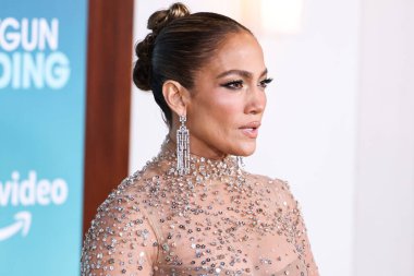 Jennifer Lopez (J.Lo) wearing a Valentino sheer dress arrives at the Los Angeles Premiere Of Amazon Prime Video's 'Shotgun Wedding' held at the TCL Chinese Theatre IMAX on January 18, 2023 in Hollywood, Los Angeles