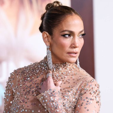 Jennifer Lopez (J.Lo) wearing a Valentino sheer dress arrives at the Los Angeles Premiere Of Amazon Prime Video's 'Shotgun Wedding' held at the TCL Chinese Theatre IMAX on January 18, 2023 in Hollywood, Los Angeles