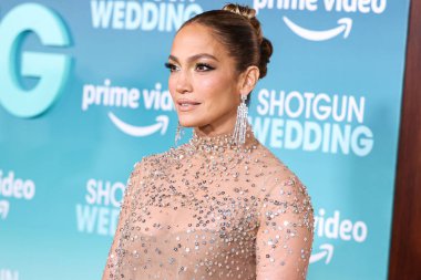 Jennifer Lopez (J.Lo) wearing a Valentino sheer dress arrives at the Los Angeles Premiere Of Amazon Prime Video's 'Shotgun Wedding' held at the TCL Chinese Theatre IMAX on January 18, 2023 in Hollywood, Los Angeles