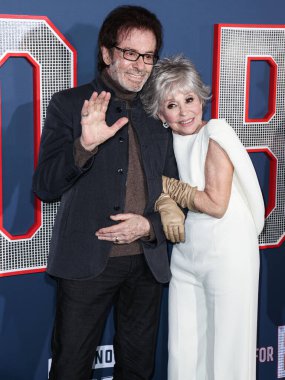 Rita Moreno and George Chakiris arrive at the Los Angeles Premiere Screening Of Paramount Pictures' '80 For Brady' held at the Regency Village Theatre on January 31, 2023 in Westwood, Los Angeles, California, United States.