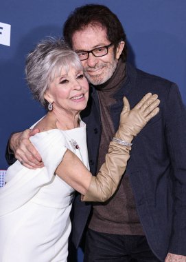 Rita Moreno and George Chakiris arrive at the Los Angeles Premiere Screening Of Paramount Pictures' '80 For Brady' held at the Regency Village Theatre on January 31, 2023 in Westwood, Los Angeles, California, United States.