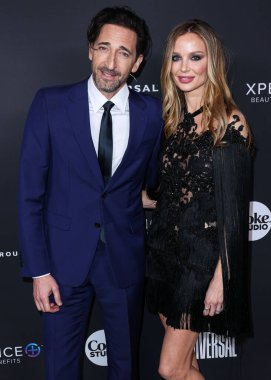American actor Adrien Brody and girlfriend/English fashion designer and actress Georgina Chapman arrive at the Universal Music Group 2023 65th GRAMMY Awards After Party held at Milk Studios Los Angeles on February 5, 2023 in Los Angeles, California