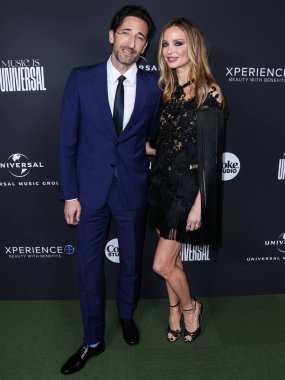 American actor Adrien Brody and girlfriend/English fashion designer and actress Georgina Chapman arrive at the Universal Music Group 2023 65th GRAMMY Awards After Party held at Milk Studios Los Angeles on February 5, 2023 in Los Angeles, California