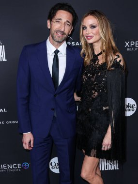 American actor Adrien Brody and girlfriend/English fashion designer and actress Georgina Chapman arrive at the Universal Music Group 2023 65th GRAMMY Awards After Party held at Milk Studios Los Angeles on February 5, 2023 in Los Angeles, California