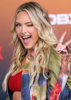American model Camille Kostek arrives at the Los Angeles Premiere Of Netflix's 'Outer Banks' Season 3 held at the Regency Village Theatre on February 16, 2023 in Westwood, Los Angeles, California, United States. 
