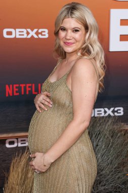 Caroline Arapoglou arrives at the Los Angeles Premiere Of Netflix's 'Outer Banks' Season 3 held at the Regency Village Theatre on February 16, 2023 in Westwood, Los Angeles, California, United States. 
