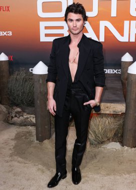 American actor Chase Stokes arrives at the Los Angeles Premiere Of Netflix's 'Outer Banks' Season 3 held at the Regency Village Theatre on February 16, 2023 in Westwood, Los Angeles, California, United States. 