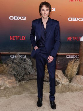 American actor Drew Starkey arrives at the Los Angeles Premiere Of Netflix's 'Outer Banks' Season 3 held at the Regency Village Theatre on February 16, 2023 in Westwood, Los Angeles, California, United States. 
