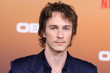 American actor Drew Starkey arrives at the Los Angeles Premiere Of Netflix's 'Outer Banks' Season 3 held at the Regency Village Theatre on February 16, 2023 in Westwood, Los Angeles, California, United States. 