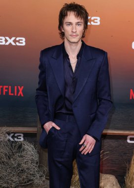 American actor Drew Starkey arrives at the Los Angeles Premiere Of Netflix's 'Outer Banks' Season 3 held at the Regency Village Theatre on February 16, 2023 in Westwood, Los Angeles, California, United States. 