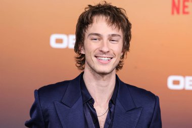 American actor Drew Starkey arrives at the Los Angeles Premiere Of Netflix's 'Outer Banks' Season 3 held at the Regency Village Theatre on February 16, 2023 in Westwood, Los Angeles, California, United States. 