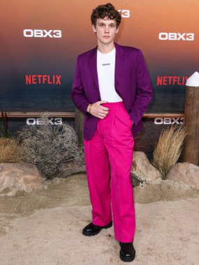 American actor Hunter Doohan arrives at the Los Angeles Premiere Of Netflix's 'Outer Banks' Season 3 held at the Regency Village Theatre on February 16, 2023 in Westwood, Los Angeles, California, United States. 