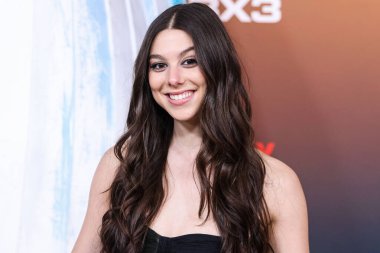 American actress Kira Kosarin arrives at the Los Angeles Premiere Of Netflix's 'Outer Banks' Season 3 held at the Regency Village Theatre on February 16, 2023 in Westwood, Los Angeles, California, United States. 