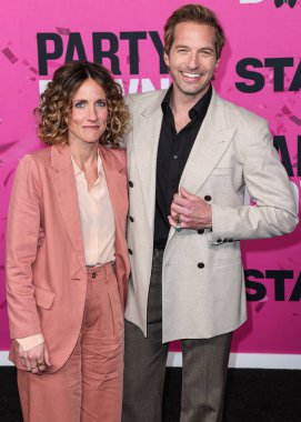 Amy Russell and Ryan Hansen arrive at the Los Angeles Premiere Of STARZ's 'Party Down' Season 3 held at the Regency Bruin Theatre on February 22, 2023 in Westwood, Los Angeles, California, United States.
