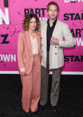 Amy Russell and Ryan Hansen arrive at the Los Angeles Premiere Of STARZ's 'Party Down' Season 3 held at the Regency Bruin Theatre on February 22, 2023 in Westwood, Los Angeles, California, United States.