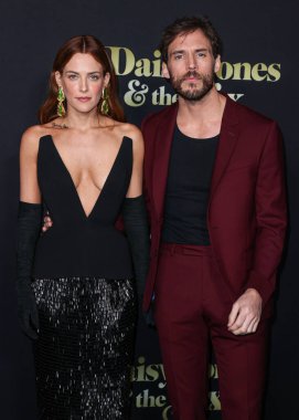 Riley Keough and Sam Claflin arrive at the Los Angeles Premiere Of Amazon Prime Video's 'Daisy Jones & The Six' Season 1 held at the TCL Chinese Theatre IMAX on February 23, 2023 in Hollywood, Los Angeles, California, United States. 