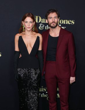 Riley Keough and Sam Claflin arrive at the Los Angeles Premiere Of Amazon Prime Video's 'Daisy Jones & The Six' Season 1 held at the TCL Chinese Theatre IMAX on February 23, 2023 in Hollywood, Los Angeles, California, United States. 