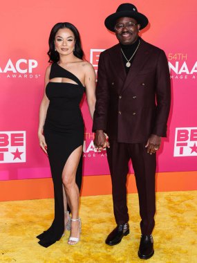 Dannella Lane and Lil Rel Howery arrive at the 54th Annual NAACP Image Awards held at the Pasadena Civic Auditorium on February 25, 2023 in Pasadena, Los Angeles, California, United States.