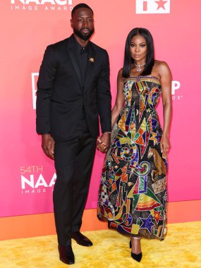 Dwyane Wade and wife Gabrielle Union arrive at the 54th Annual NAACP Image Awards held at the Pasadena Civic Auditorium on February 25, 2023 in Pasadena, Los Angeles, California, United States.