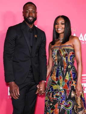 Dwyane Wade and Gabrielle Union, recipients of the President's Award pose in the press room at the 54th Annual NAACP Image Awards held at the Pasadena Civic Auditorium on February 25, 2023 in Pasadena, Los Angeles, California, United States.