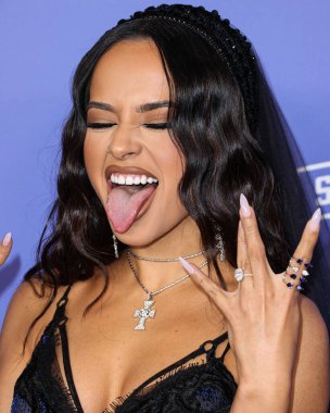 Becky G wearing a Nicolas Jebran dress arrives at the 2023 Billboard Women In Music held at the YouTube Theater on March 1, 2023 in Inglewood, Los Angeles, California, United States.