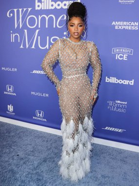 Chloe Bailey wearing a Giambattista Valli dress and Jacob and Co. jewelry arrives at the 2023 Billboard Women In Music held at the YouTube Theater on March 1, 2023 in Inglewood, Los Angeles, California, United States.  clipart