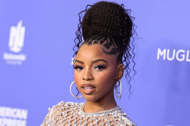 Chloe Bailey wearing a Giambattista Valli dress and Jacob and Co. jewelry arrives at the 2023 Billboard Women In Music held at the YouTube Theater on March 1, 2023 in Inglewood, Los Angeles, California, United States. 