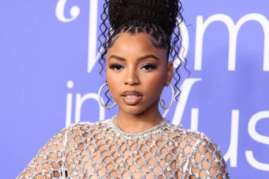 Chloe Bailey wearing a Giambattista Valli dress and Jacob and Co. jewelry arrives at the 2023 Billboard Women In Music held at the YouTube Theater on March 1, 2023 in Inglewood, Los Angeles, California, United States. 