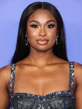 Coco Jones wearing a Cucculelli Shaheen Collection crop top and pants arrives at the 2023 Billboard Women In Music held at the YouTube Theater on March 1, 2023 in Inglewood, Los Angeles, California, United States.