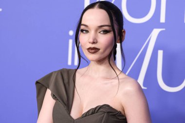 Dove Cameron wearing a Jacquemus dress, Giuseppe Zanotti shoes, and Tyler Ellis clutch arrives at the 2023 Billboard Women In Music held at the YouTube Theater on March 1, 2023 in Inglewood, Los Angeles, California, United States. 