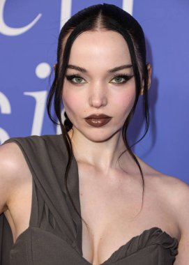 Dove Cameron wearing a Jacquemus dress, Giuseppe Zanotti shoes, and Tyler Ellis clutch arrives at the 2023 Billboard Women In Music held at the YouTube Theater on March 1, 2023 in Inglewood, Los Angeles, California, United States. 