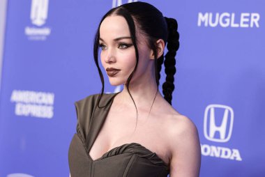 Dove Cameron wearing a Jacquemus dress, Giuseppe Zanotti shoes, and Tyler Ellis clutch arrives at the 2023 Billboard Women In Music held at the YouTube Theater on March 1, 2023 in Inglewood, Los Angeles, California, United States. 