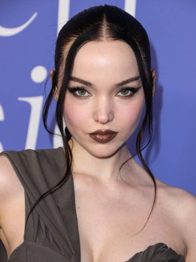 Dove Cameron wearing a Jacquemus dress, Giuseppe Zanotti shoes, and Tyler Ellis clutch arrives at the 2023 Billboard Women In Music held at the YouTube Theater on March 1, 2023 in Inglewood, Los Angeles, California, United States. 