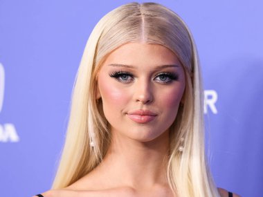 Loren Gray wearing a Shushu Tong dress arrives at the 2023 Billboard Women In Music held at the YouTube Theater on March 1, 2023 in Inglewood, Los Angeles, California, United States. 