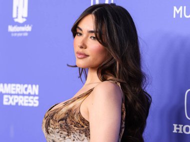 Madison Beer wearing a Roberto Cavalli dress arrives at the 2023 Billboard Women In Music held at the YouTube Theater on March 1, 2023 in Inglewood, Los Angeles, California, United States. 