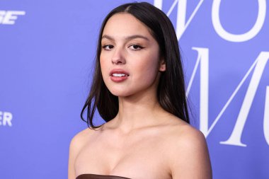 Olivia Rodrigo wearing a Jacquemus dress, Giuseppe Zanotti shoes, and Tyler Ellis clutch arrives at the 2023 Billboard Women In Music held at the YouTube Theater on March 1, 2023 in Inglewood, Los Angeles, California, United States. 