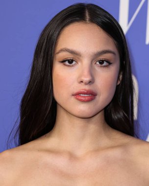 Olivia Rodrigo wearing a Jacquemus dress, Giuseppe Zanotti shoes, and Tyler Ellis clutch arrives at the 2023 Billboard Women In Music held at the YouTube Theater on March 1, 2023 in Inglewood, Los Angeles, California, United States. 