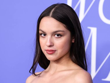 Olivia Rodrigo wearing a Jacquemus dress, Giuseppe Zanotti shoes, and Tyler Ellis clutch arrives at the 2023 Billboard Women In Music held at the YouTube Theater on March 1, 2023 in Inglewood, Los Angeles, California, United States. 