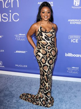 Quinta Brunson wearing a Sergio Hudson dress arrives at the 2023 Billboard Women In Music held at the YouTube Theater on March 1, 2023 in Inglewood, Los Angeles, California, United States.  clipart