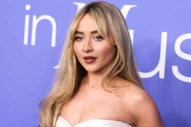 Sabrina Carpenter wearing a Cong Tri dress arrives at the 2023 Billboard Women In Music held at the YouTube Theater on March 1, 2023 in Inglewood, Los Angeles, California, United States. 