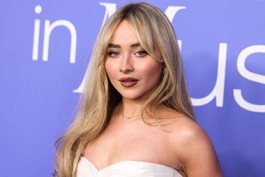Sabrina Carpenter wearing a Cong Tri dress arrives at the 2023 Billboard Women In Music held at the YouTube Theater on March 1, 2023 in Inglewood, Los Angeles, California, United States. 