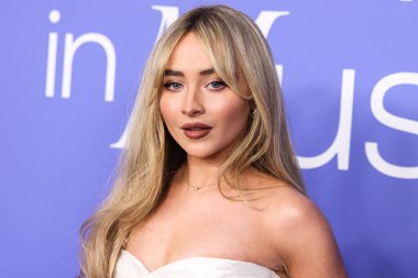 Sabrina Carpenter wearing a Cong Tri dress arrives at the 2023 Billboard Women In Music held at the YouTube Theater on March 1, 2023 in Inglewood, Los Angeles, California, United States. 