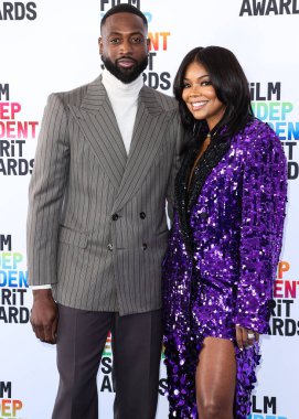 Dwyane Wade and wife Gabrielle Union arrive at the 2023 Film Independent Spirit Awards held at the Santa Monica Beach on March 4, 2023 in Santa Monica, Los Angeles, California, United States.