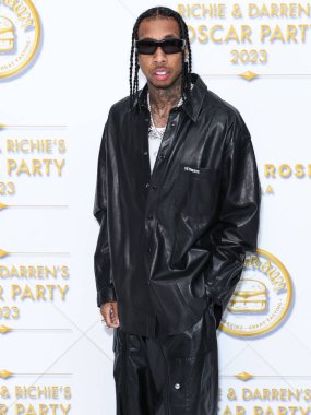 American rapper Tyga (Micheal Ray Stevenson) arrives at the Darren Dzienciol and Richie Akiva Oscar Party 2023 held at a Private Residence on March 10, 2023 in Bel Air, Los Angeles, California, United States.  clipart