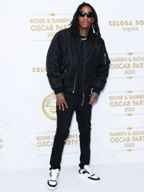Amerikalı rapçi Wiz Khalifa (Cameron Jibril Thomaz), 10 Mart 2023 tarihinde Bel Air, Los Angeles, Kaliforniya, ABD 'de düzenlenen Darren Dzienciol ve Richie Akiva Oscar Partisi 2023' e geldi.. 