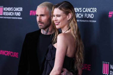 Amerikalı pop rock grubu Maroon 5 'tan Amerikalı şarkıcı ve söz yazarı Adam Levine ve eşi / Namibyalı model Behati Prinsloo, ABD' nin Beverly Wilshire kentinde düzenlenen The Women 's Cancer Research Fund' s An Unforgetable Evening Benefit Gala 2023 'e geldiler.