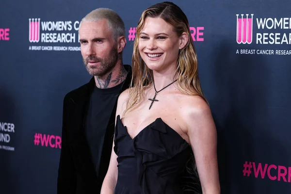 stock image American singer and songwriter Adam Levine of American pop rock band Maroon 5 and wife/Namibian model Behati Prinsloo arrive at The Women's Cancer Research Fund's An Unforgettable Evening Benefit Gala 2023 held at the Beverly Wilshire, USA